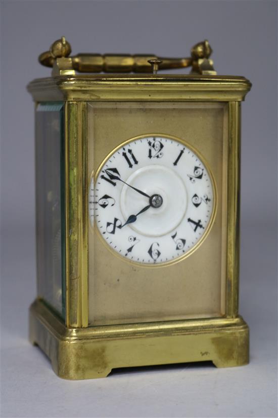 A French gilt brass carriage clock, with hour repeat and leather carrying case